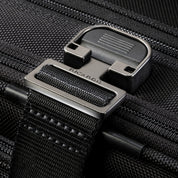 Ricardo Flight Essentials Softside Carry-On - Black, Luggage strap fastener view