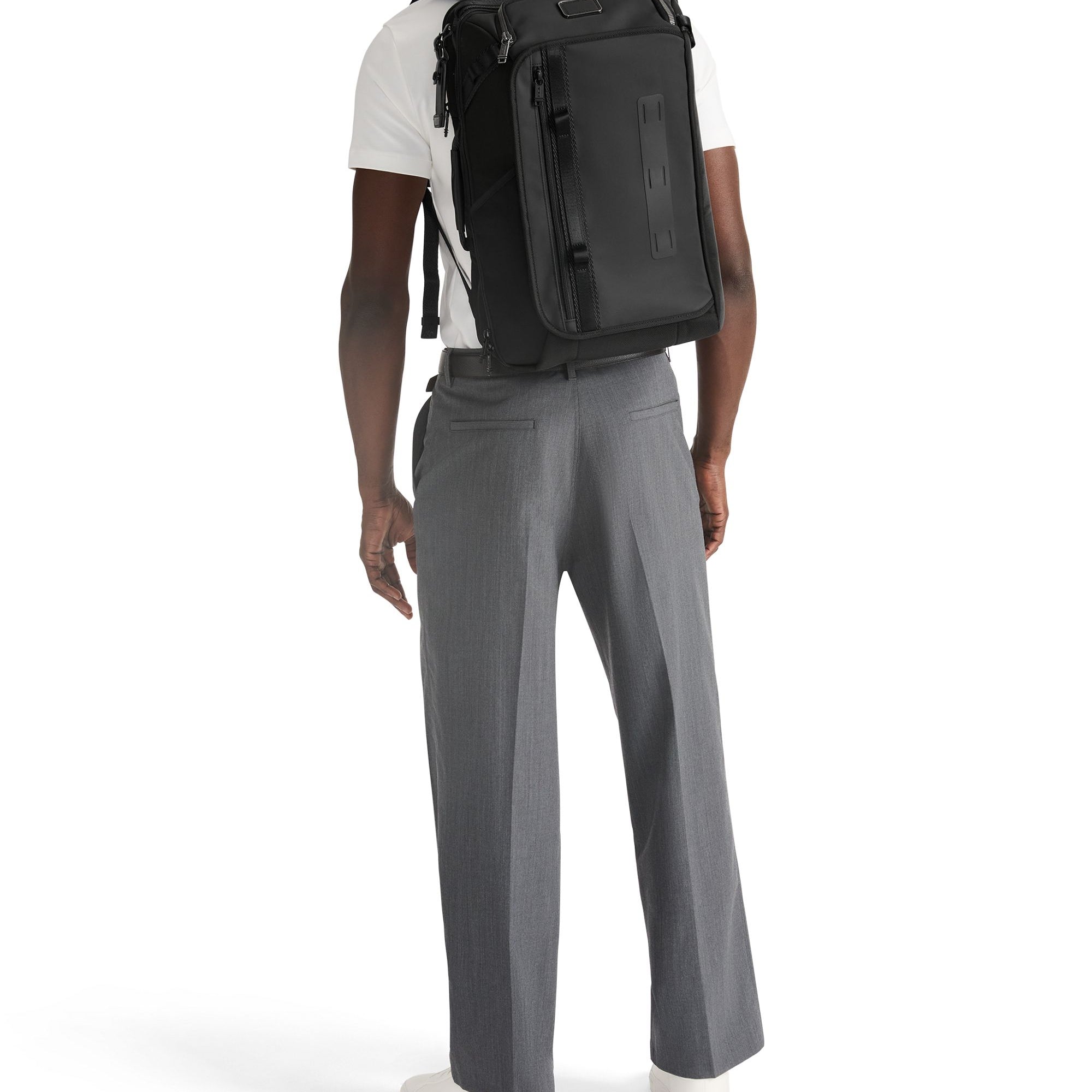 TumiDetrickTravelBackpackBlackManwearingpack.jpg